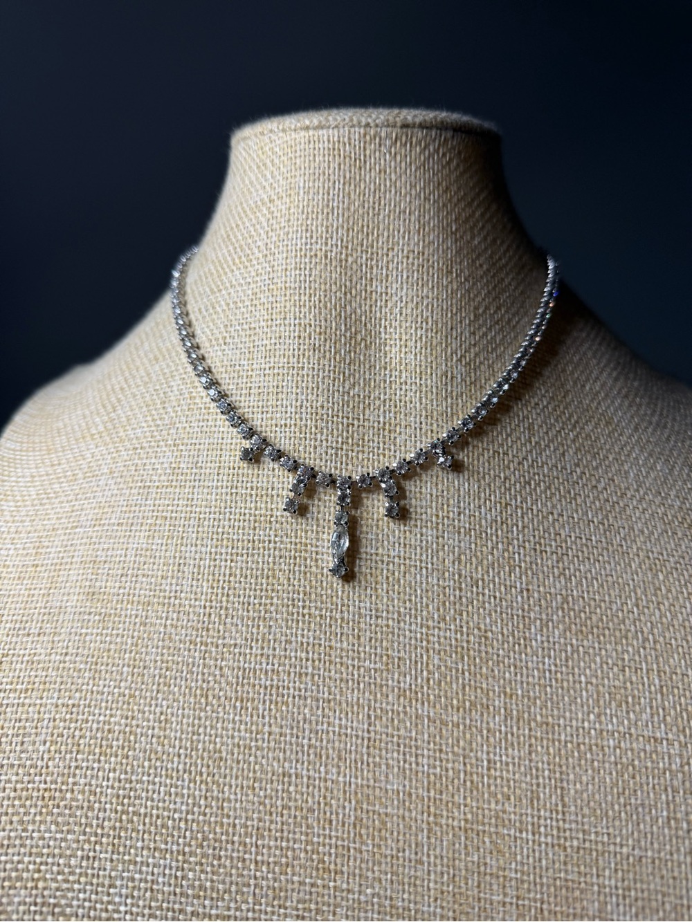 Cocktail design with prong set Chaton stones and central drop detail.